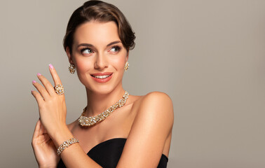 Beautiful girl with jewelry . A set of jewelry for woman ,necklace ,earrings and bracelet. Beauty...