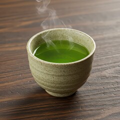 Steaming green tea served in a rustic ceramic cup, placed on a wooden table, ideal for calm, wellness, and tea culture themes.