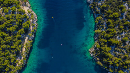 Aerial seascape with clear blue and green tones
