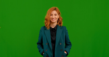 Portrait of happy pretty woman shrugging shoulders and gesturing on green screen background. Businesswoman unsure raising shoulders isolated.