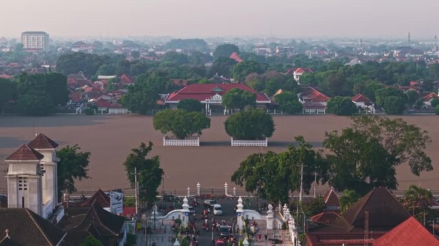 Aerial view of the Yogyakarta Palace, Alun-alun Utara and the surrounding buildings with its roads filled with vehicles and people, Yogyakarta, Daerah Istimewa Yogyakarta, Indonesia.