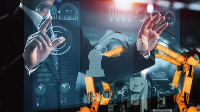 Engineer use cybernated robotic software to control industry robot arm in factory . Automation manufacturing process controlled by specialist using IOT software connected to internet network .