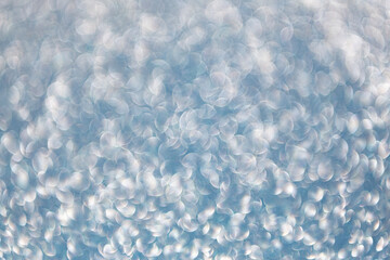 Blur glitter backdrop. Glitter shimmer background. Defocused shimmer. Bokeh backdrop shimmer. Bokeh effect. Glitter shine. Bokeh shimmering background. Blurred defocused background. Glitter dust