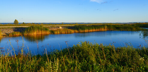 Fototapeta premium Pond on the Väinatamm, the largest causeway in Estonia that connects the islands of Muhu and Saaremaa across the Väike Strait in the Baltic Sea