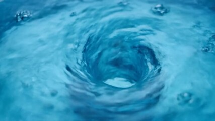 A mesmerizing close-up of a deep blue water vortex, swirling downwards with ripples on the surface - Powered by Adobe