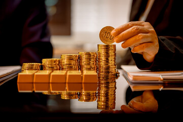 A suited Asian analyst confirms the tangible value of global gold holdings, carefully placing a...