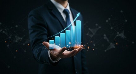 Businessman holding a glowing virtual bar graph with an upward arrow, symbolizing business development, financial success, and stock market investment growth