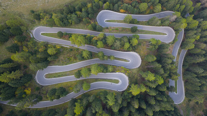 hairpin serpentine mountain forest road. asphalt road. Stelviopass Italy.