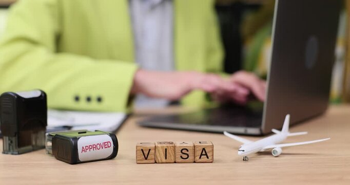 Visa application process and approval in an office setting with travel plans