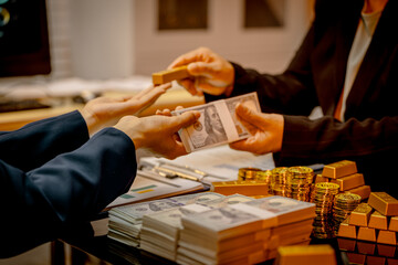 A suited Asian analyst confirms the tangible value of global gold holdings, carefully placing a...