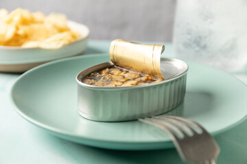 Canned cockles served on turquoise dish