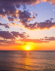 Fototapeta premium Colorful sunset over calm ocean