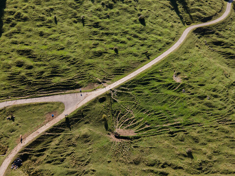 Aerial view of winding roads cutting through the vibrant green hills, Bad Hindelang, Allg&Atilde;&curren;u, Bayern, Deutschland.