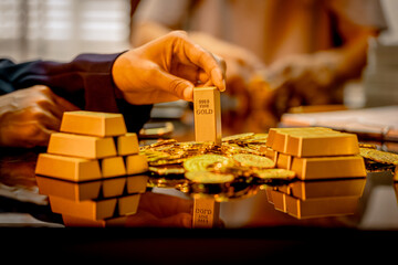 A suited Asian analyst confirms the tangible value of global gold holdings, carefully placing a...