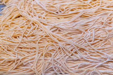 Fresh raw noodles in market