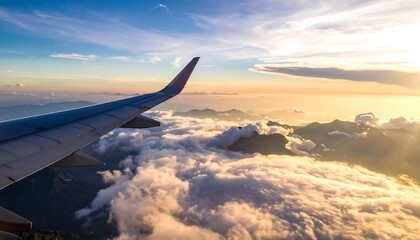 Fototapeta premium Airplane Wing Above Clouds During Sunset.
