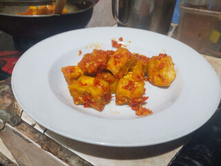 Spicy fried tofu with chili sauce a delicious Indonesian dish made from crispy tofu cubes stir-fried with red chili, garlic, and spices. Perfect vegan protein meal for lunch or dinner ideas.