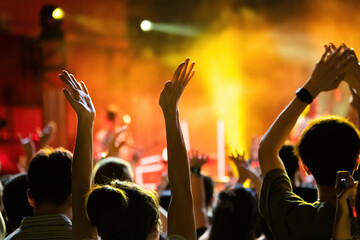 People clap hands at the concert