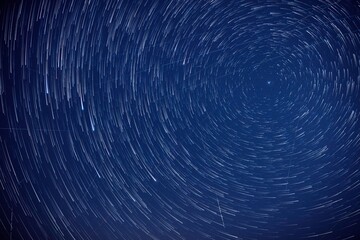 Milky way star-trails and constellations photographed from a dark countryside location.