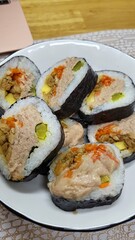 Delicious Korean Tuna Kimbap Rolls on a White Plate