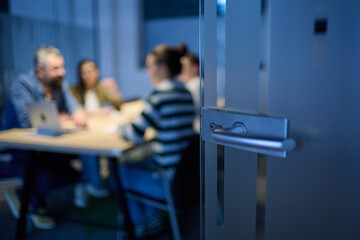 Smiling confident businessman leading a creative meeting in a modern office, symbolizing leadership, teamwork, collaboration, and success in a professional business environment.