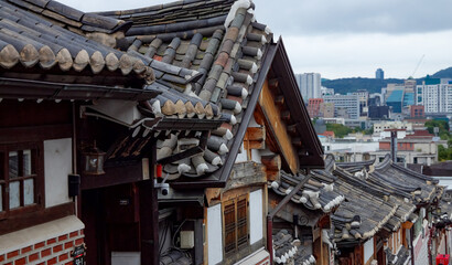 Traditional Korean architecture against modern high rise buildings in Seoul