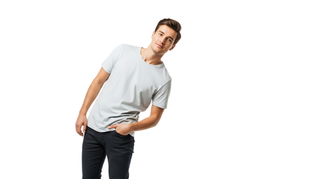 A young man in a light grey t-shirt and dark trousers, posing with his hand casually placed in his pocket.