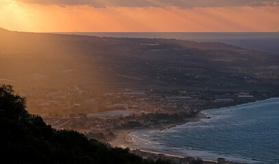 Dramatic sky and colors during a sunset at the coast of Italy near Pizzo in Calabria