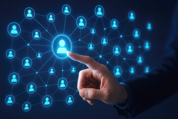 Finger touching a glowing icon in a complex digital network of people business technology