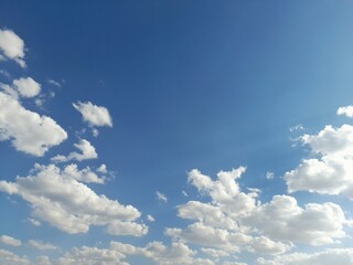 White, Fluffy Cumulus Clouds in a Clear Blue Sky