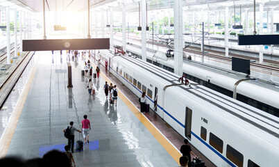 People walking on train station platform © xy
