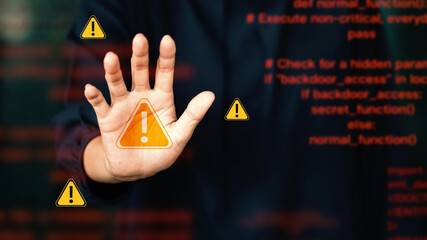 Cyber ​​security warning sign with warning icon over red source code