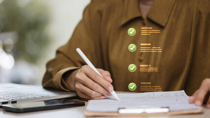 Compliance checklist, green check mark with handwritten note by businesswoman