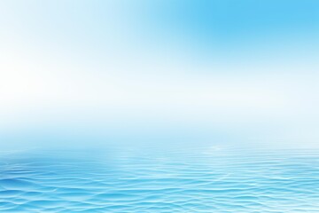 Obraz premium Tranquil blue ocean surface gently rippling under a clear sky, creating a serene and peaceful atmosphere