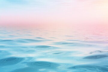 Tranquil ocean surface reflecting the soft pastel hues of the sunrise sky, creating a serene and dreamy atmosphere