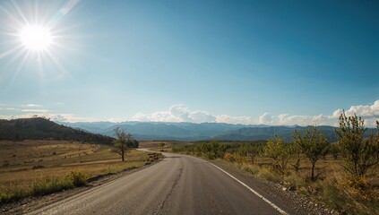 Naklejka premium Extended pathway leading to distant peaks