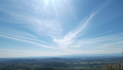 Obraz premium Bright sun and clear blue sky over natural landscape