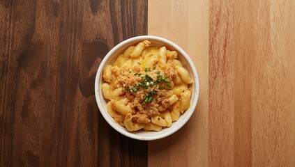 Cheesy Pasta Topped with Bread Crumbs and Fresh Chives on Contrasting Wooden Backgrounds