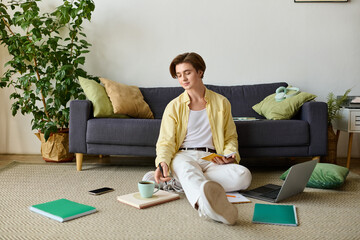 Fashionable young man relaxing in a cozy room while enjoying a quiet moment of creativity