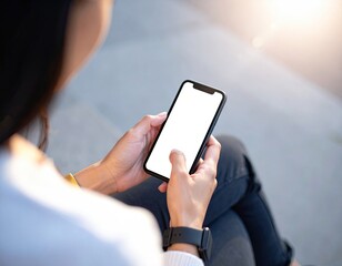 Woman's hands holding a sleek smartphone with a blank screen, shot from the shoulders up