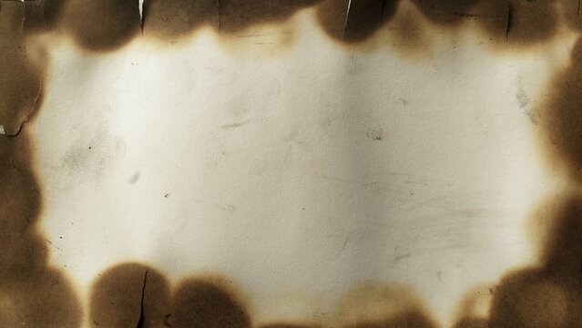 Vintage paper background with aged parchment texture and burnt edges. Aged parchment paper with burned edges and weathered edges. Vintage paper with space for text or design.