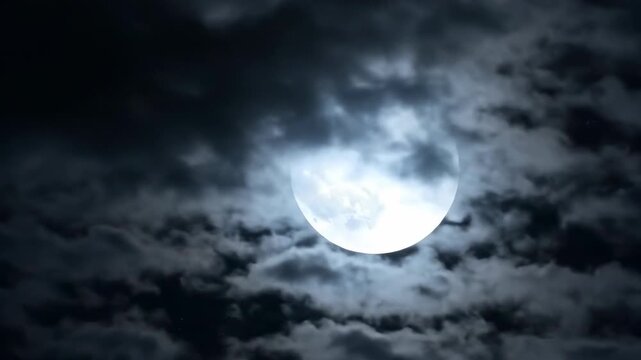 Mystic Midnight Moon: A celestial orb illuminates the night sky, casting an ethereal glow through a veil of dark, dramatic clouds. Reflecting mystery and serenity. 