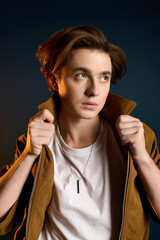 Fototapeta premium Young handsome man exuding confidence and style in a modern setting