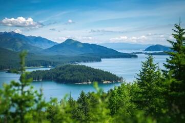 Breathtaking panorama of towering peaks, dense greenery, and tranquil sea in a coastal archipelago.