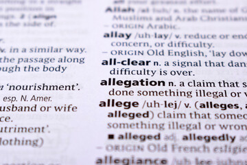 Fototapeta premium Close Up Of English Dictionary Page With Word - Allegation