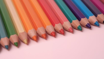 Colored Pencils Arranged in a Row a Spectrum of Hues on a Gentle Backdrop.