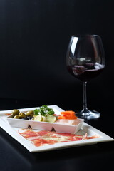A gourmet meal with wine, presenting an elegant dining experience
