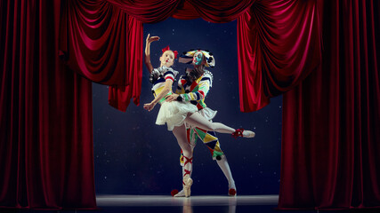 Embrace of motion. Mime and ballerina dancing in spotlight on theater stage. Concept of teamwork, passion, artistic unity for storytelling, editorial, and visual communication.