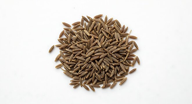 A close-up shot of a small, scattered pile of dark brown cumin seeds on a white surface - Powered by Adobe