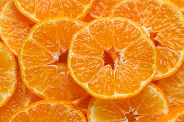 Juicy sliced mandarins as food background